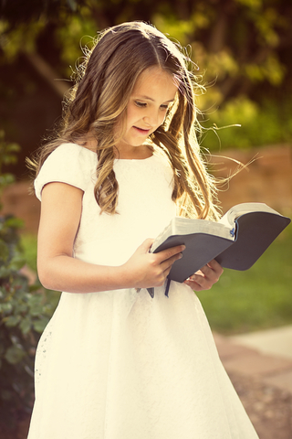 http://www.dreamstime.com/royalty-free-stock-photo-cute-little-girl-reading-bible-church-dress-outdoors-image31582615