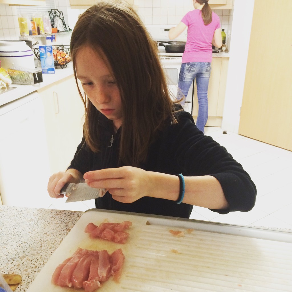 My daughter Meredith (10) chopping chicken for Chicken fingers.